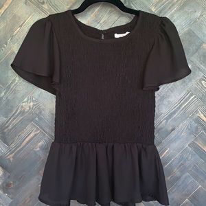 Black fitted blouse with puffed out sleeves/waist